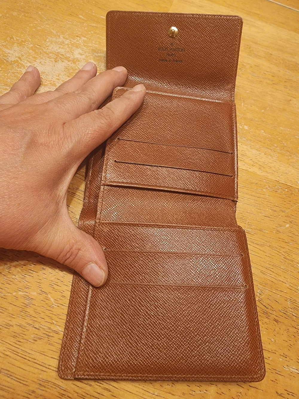 vintage Louis Vuitton Monogram Elise Wallet crafted in the classic brown LV